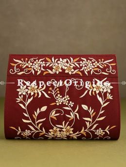 Red Parsi Gara Embroidery Clutch With Detachable Metal Strap and Gul-e-bulbul pattern in Golden embroidery.; RespectOrigins.com
